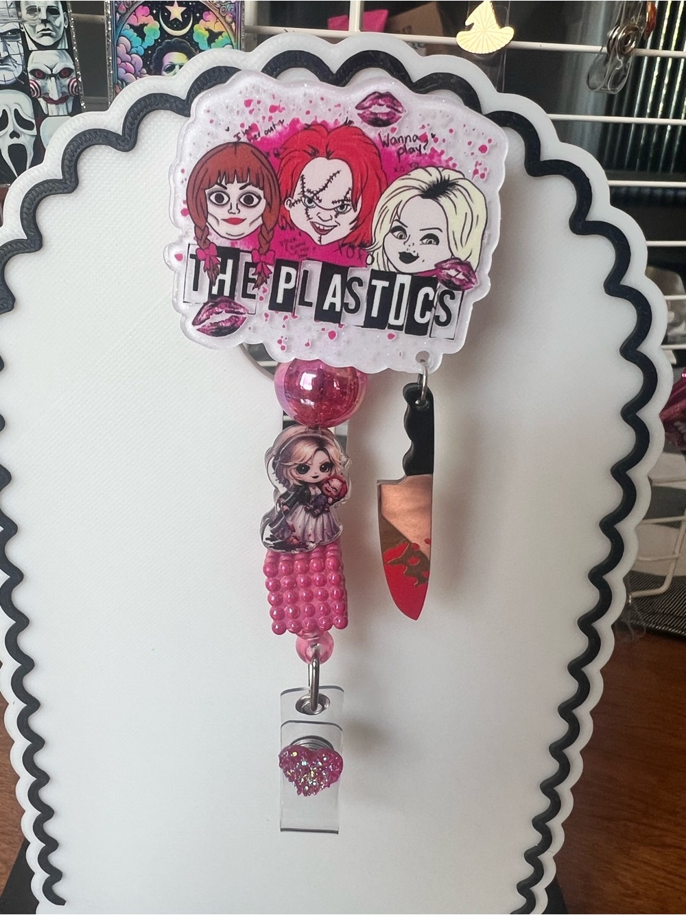 The Plastics Pink Character Badge Reel